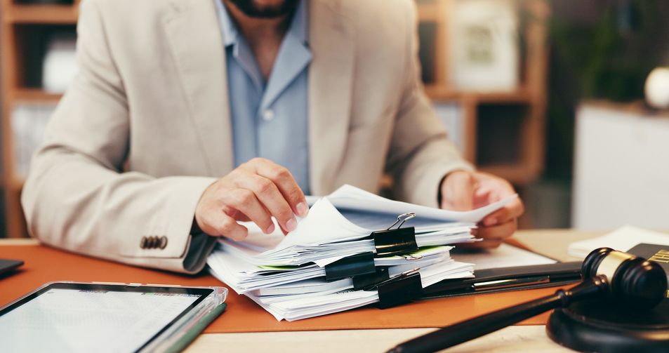 Hands, judge and stack with documents at office for legal review, administration and investigation.